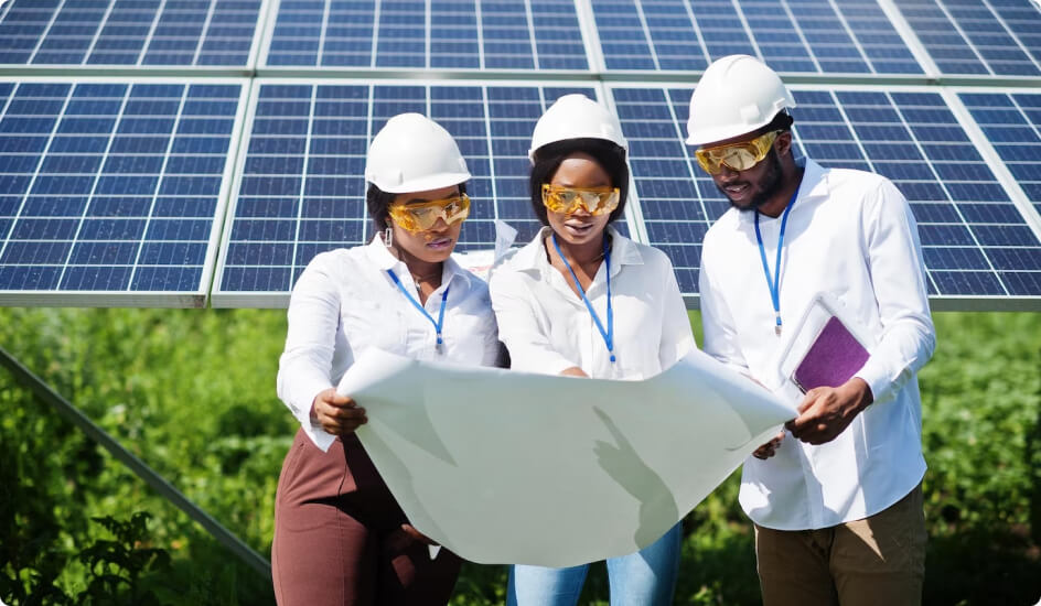 SHSEIP engineers reviewing plans at a solar installation