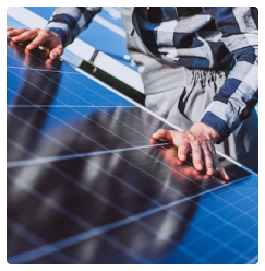 SHSEIP technician performing maintenance on solar panels